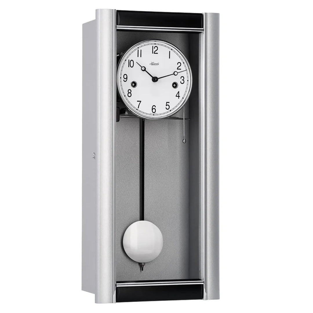 Silver wall clock with pendulum on a white background