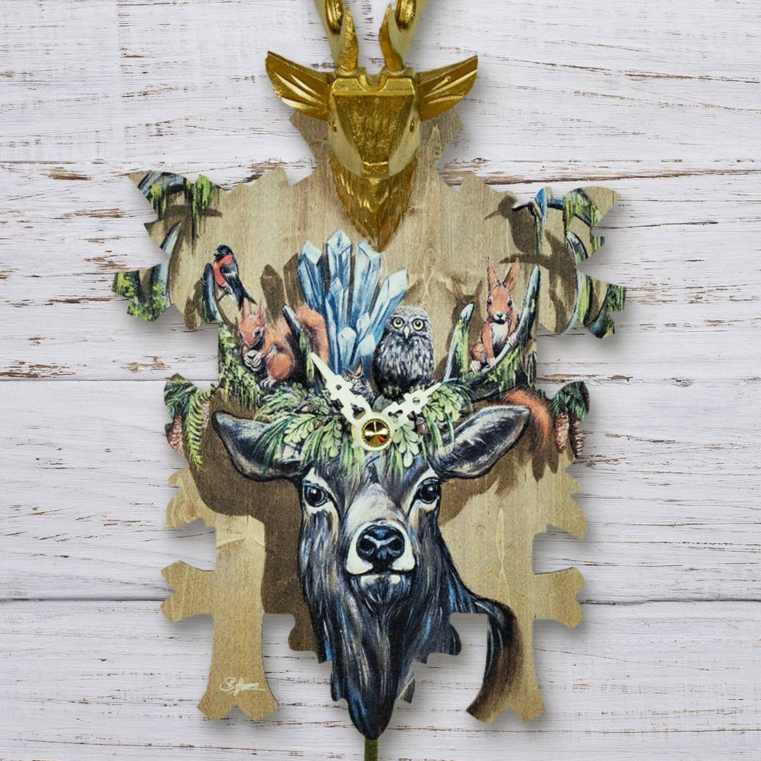 Decorative wall art with a deer head design on a wooden background