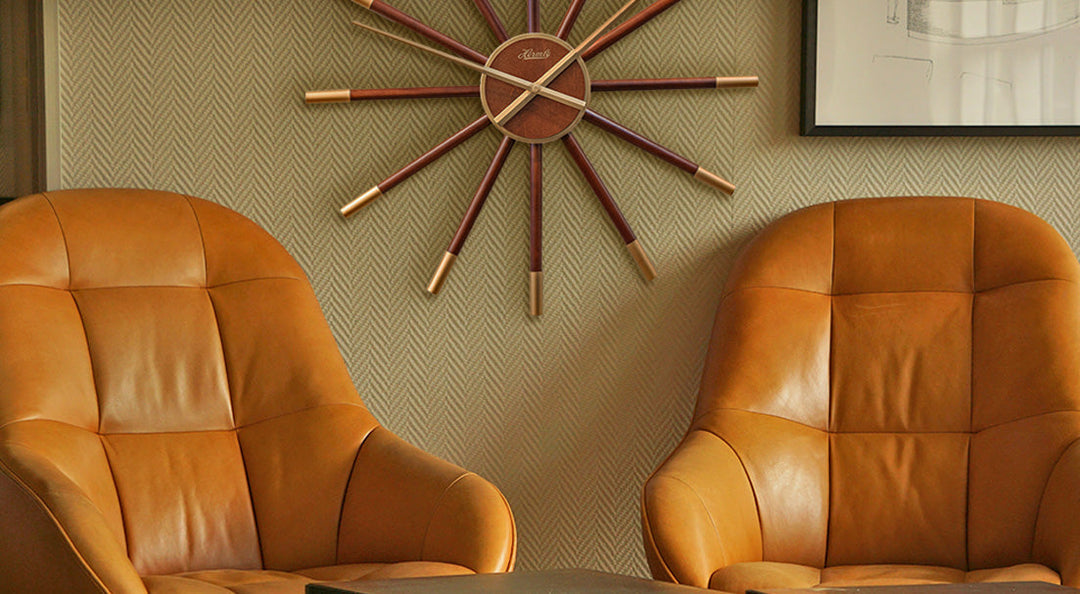 Mid-Century Modern clock in living room with orange-brown leather chairs