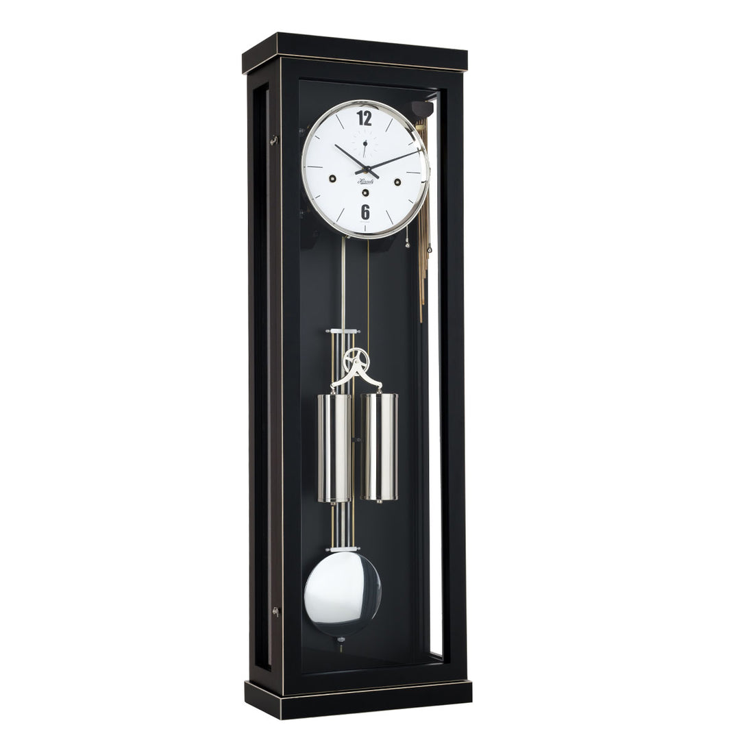 Black wall clock with dual silver weights and pendulum on a white background