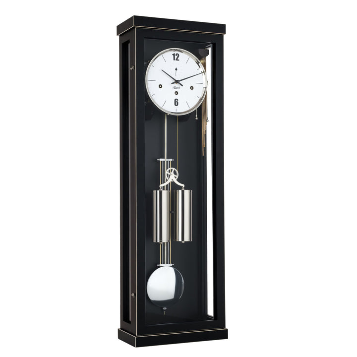 Black wall clock with dual silver weights and pendulum on a white background