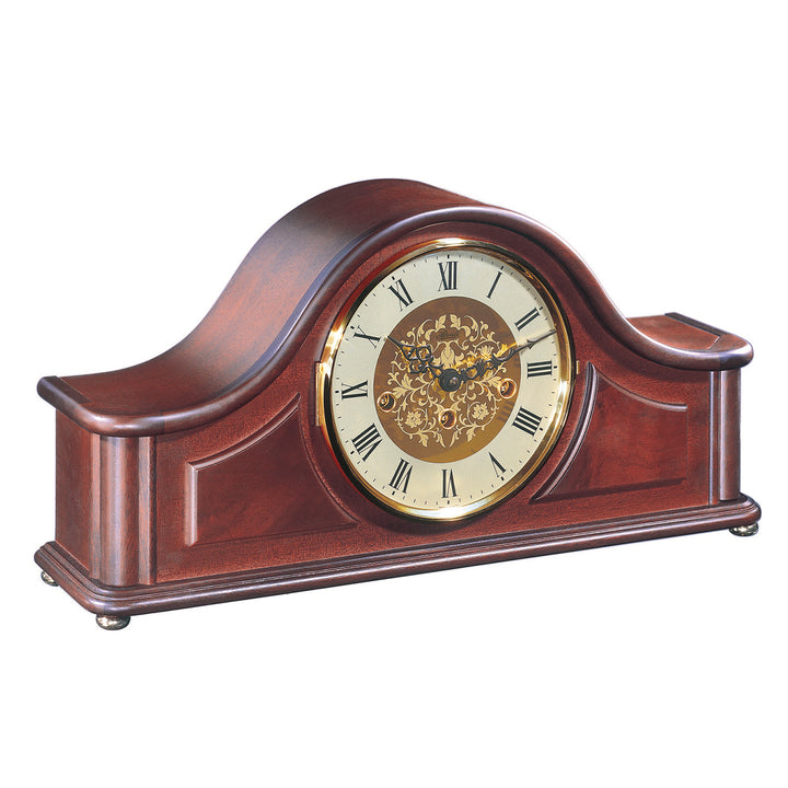 Wooden mantel clock with brass highlights and intricate roman numeral face