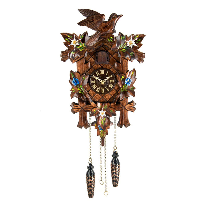 Wooden cuckoo clock with detailed design featuring blue flowers and birds on a white background