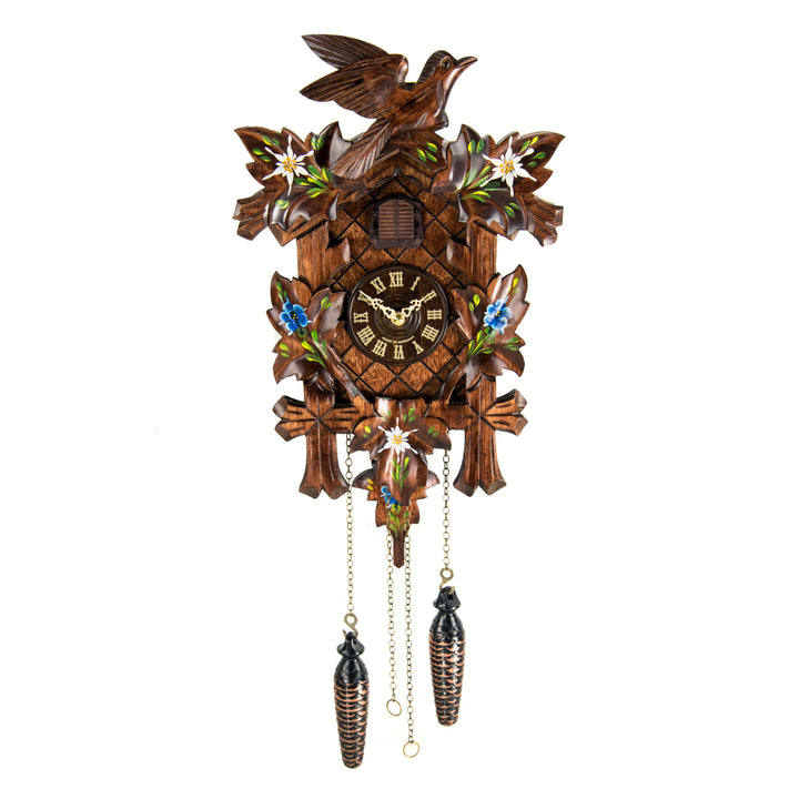 Wooden cuckoo clock with detailed design featuring blue flowers and birds on a white background
