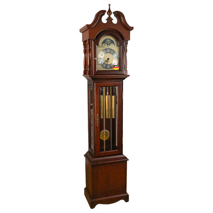 Cherry wood Grandmother clock with brass highlights and silver face on white background.