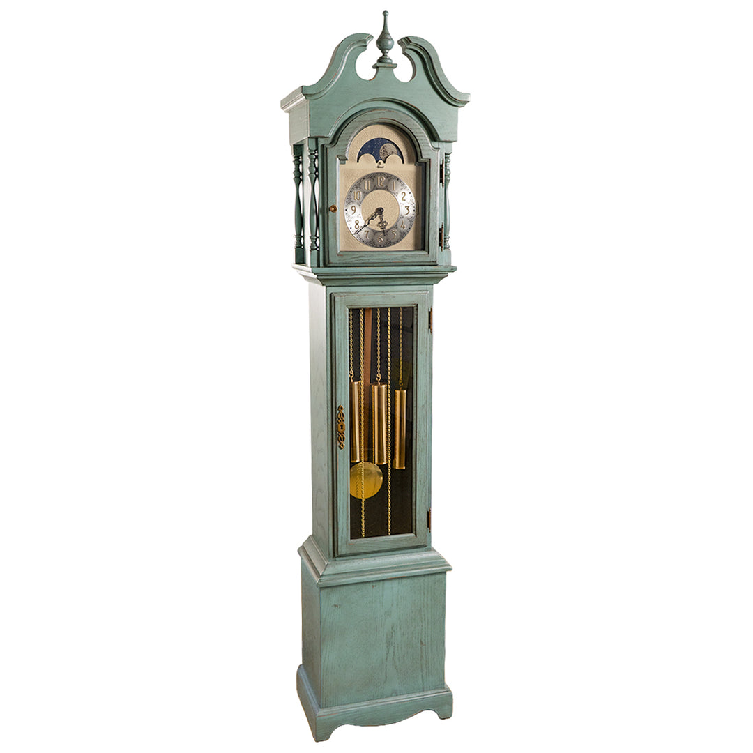 Green finish wood Grandmother clock with brass highlights and silver face on white 