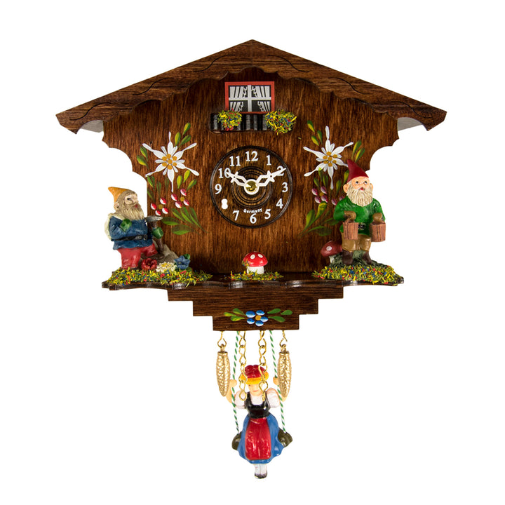 traditional german style cuckoo clock with gnomes, painted flowers and girl on swing on white background.