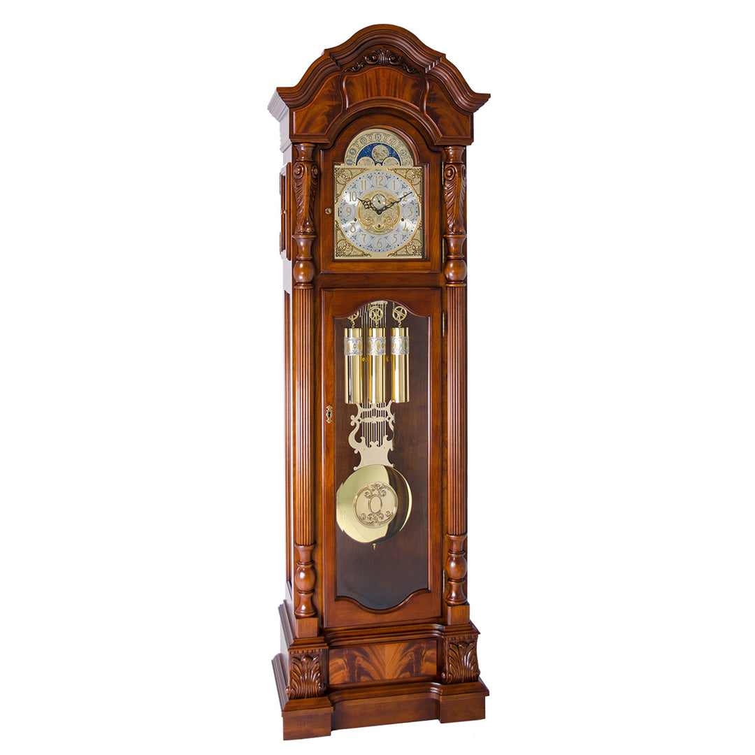 Cherry wood grandfather clock with detailed brass design on a white background