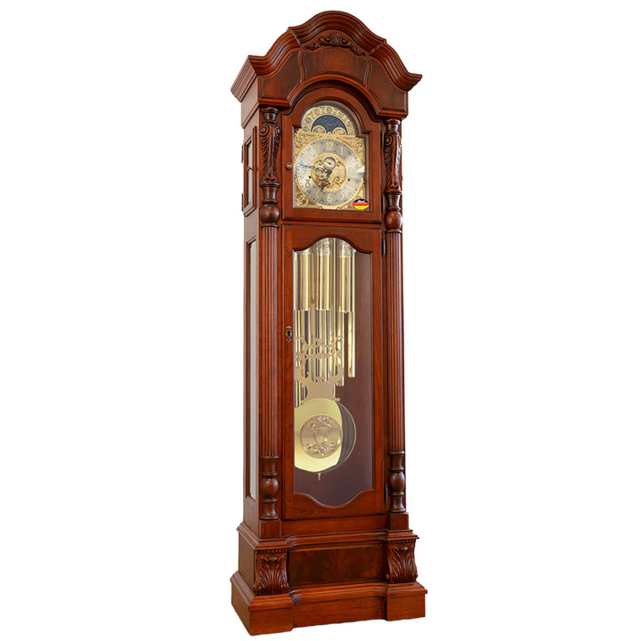 Cherry wood grandfather clock with detailed brass design and chime tubes on a white background.