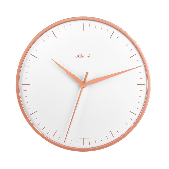 Wall clock with rose gold highlights and white face on white background.