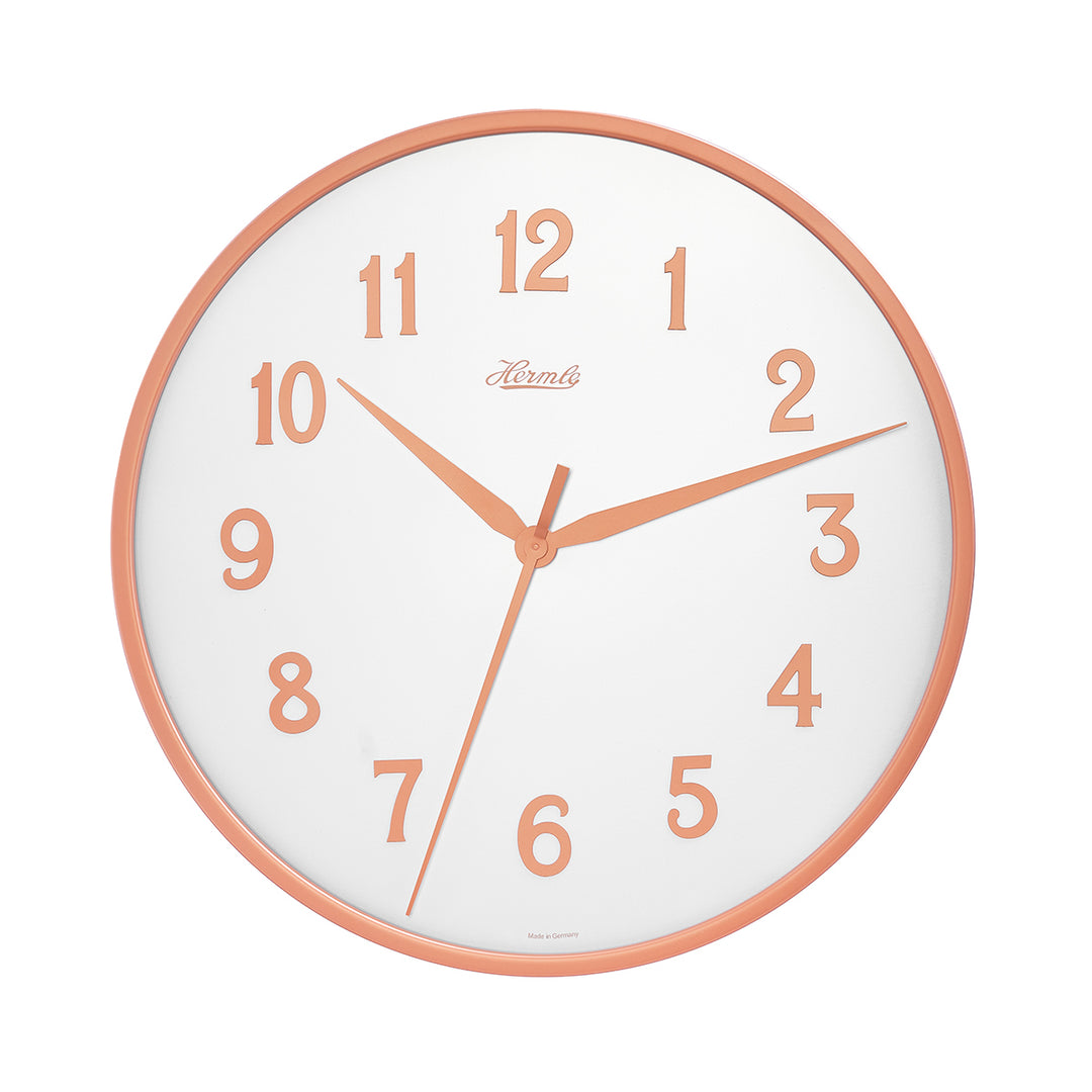 Wall clock with white face and gold numbers with Hermle logo on white background.