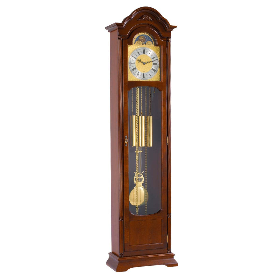 Walnut Grandfather clock with brass face and pendulum on white background