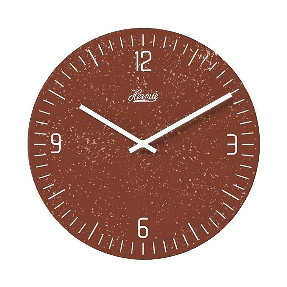 Reddish brown patterned wall clock with white hands and Arabic numerals on white background.