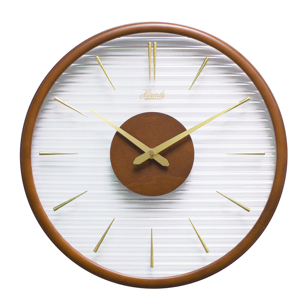 Wooden wall clock with gold numeral markings and clear ridged plastic face on white background.