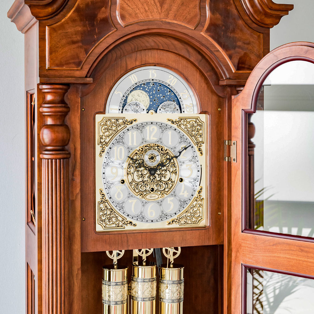 Close up of intricate grandfather clock face made with highly detailed brass