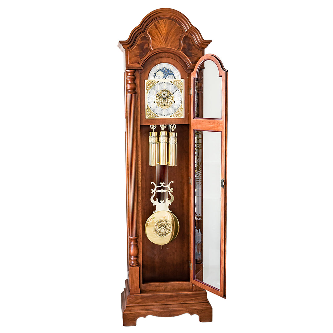 Wooden grandfather clock with open glass door on a white background