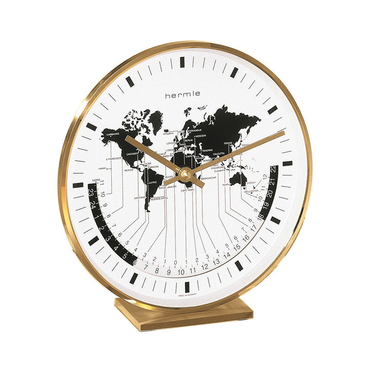 Brass desk clock on white background with brass hands and world map on 