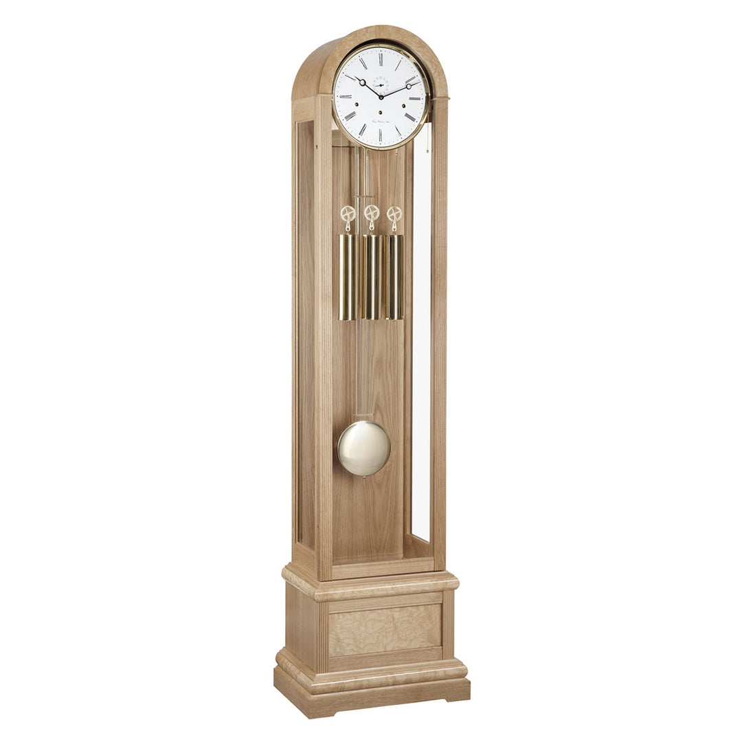 Oak Grandfather clock with brass weights and white face on white background