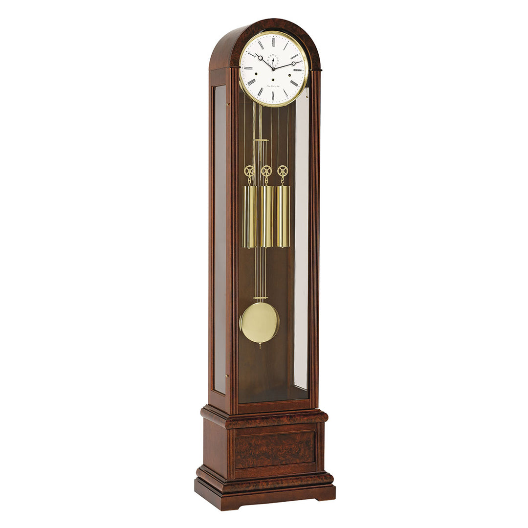 Walnut Grandfather clock with brass weights and white face on white background