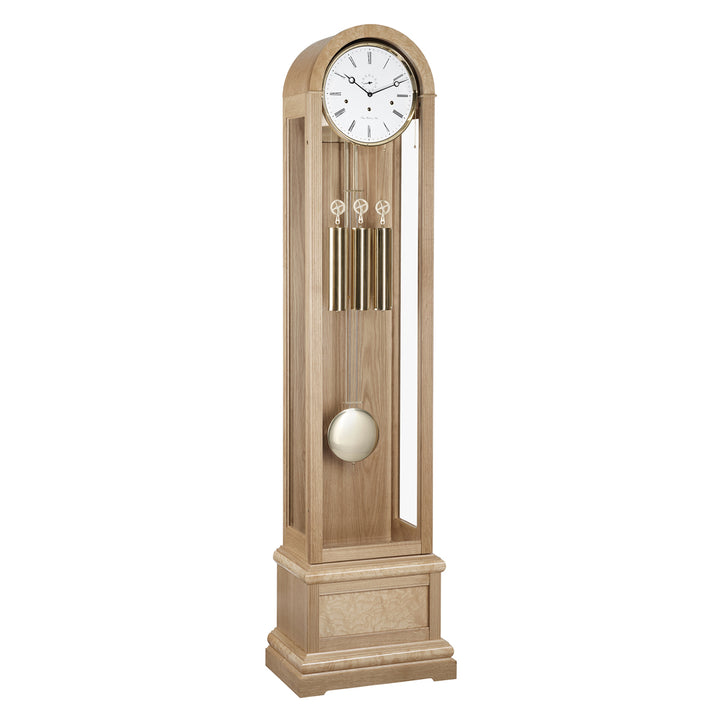 Oak Grandfather clock with brass weights and white face on white 