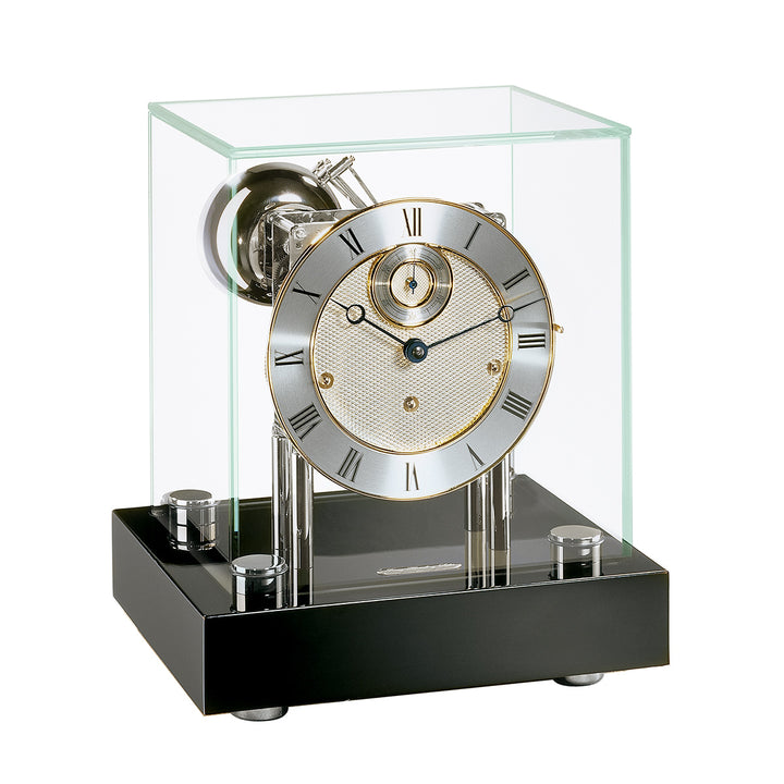 Black desk clock with glass cube case and nickel clock face with brass highlights