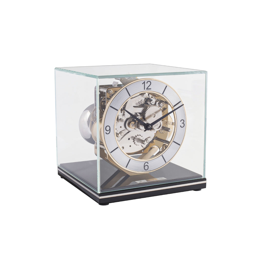 Mechanical desk clock with glass case, black base  and intricate silver gears
