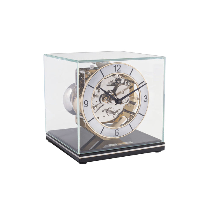 Mechanical desk clock with glass case, black base  and intricate silver gears