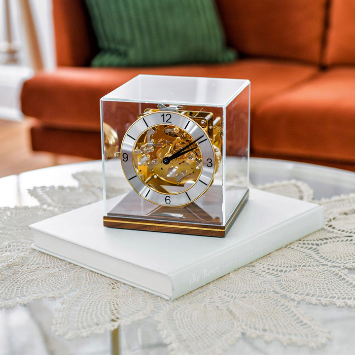Livingroom coffee table with ornate glass clock with intricate metal gears