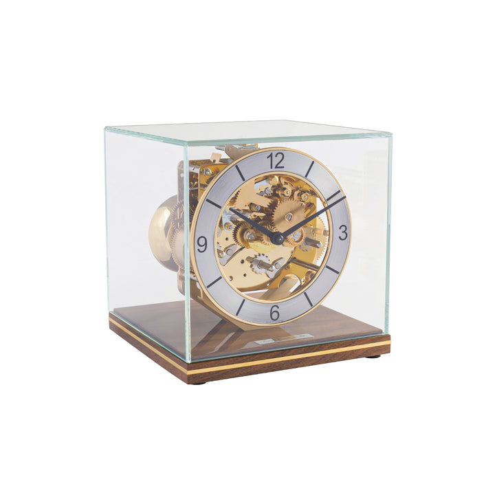 Mechanical desk clock with glass case, walnut base and intricate brass gears