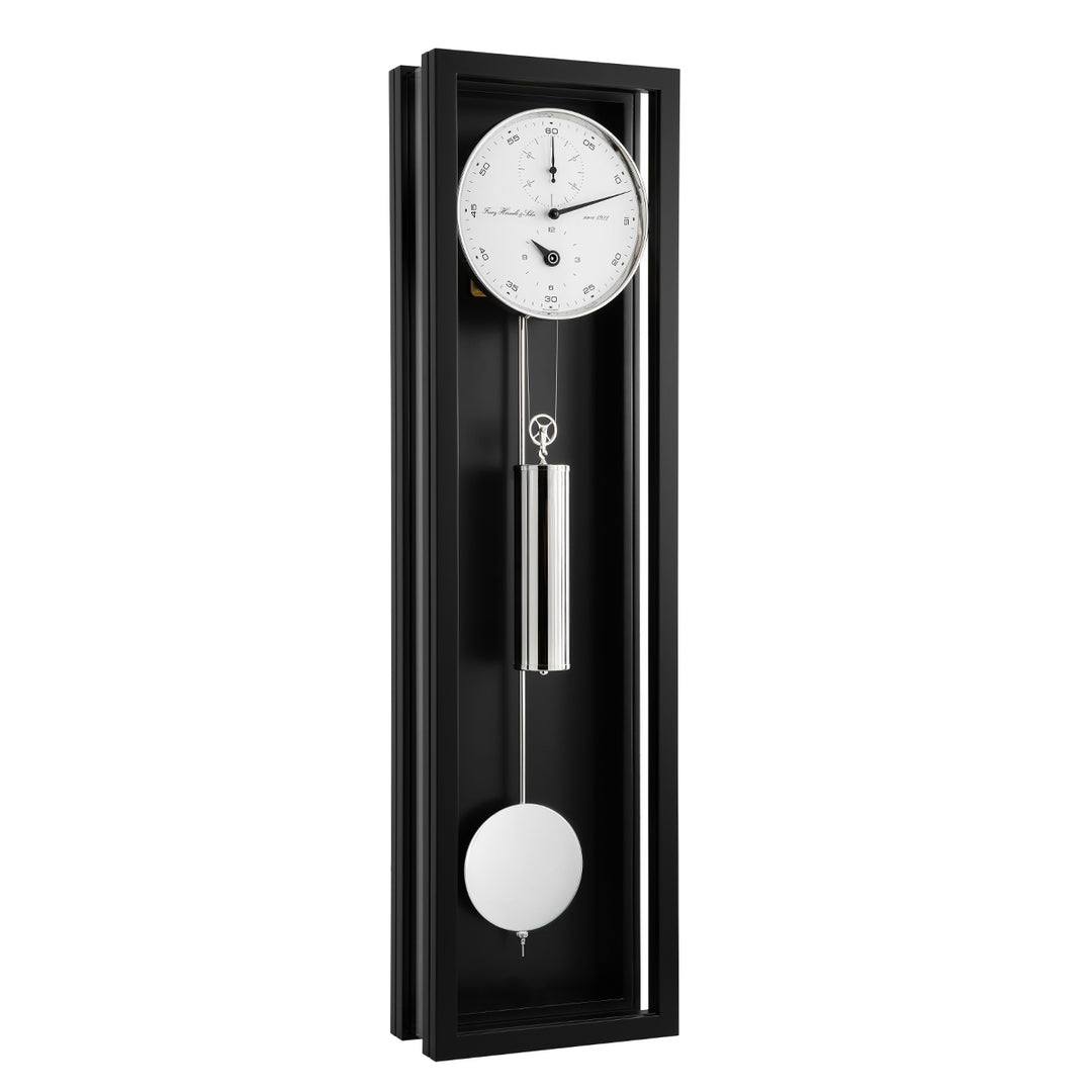 Black wall clock with pendulum on a white background