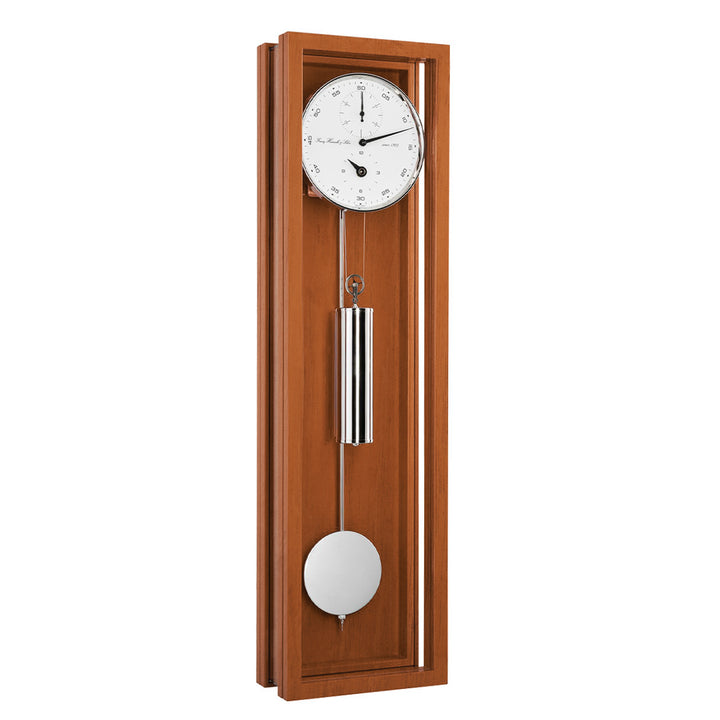 Cherry wood wall clock with pendulum on a white background