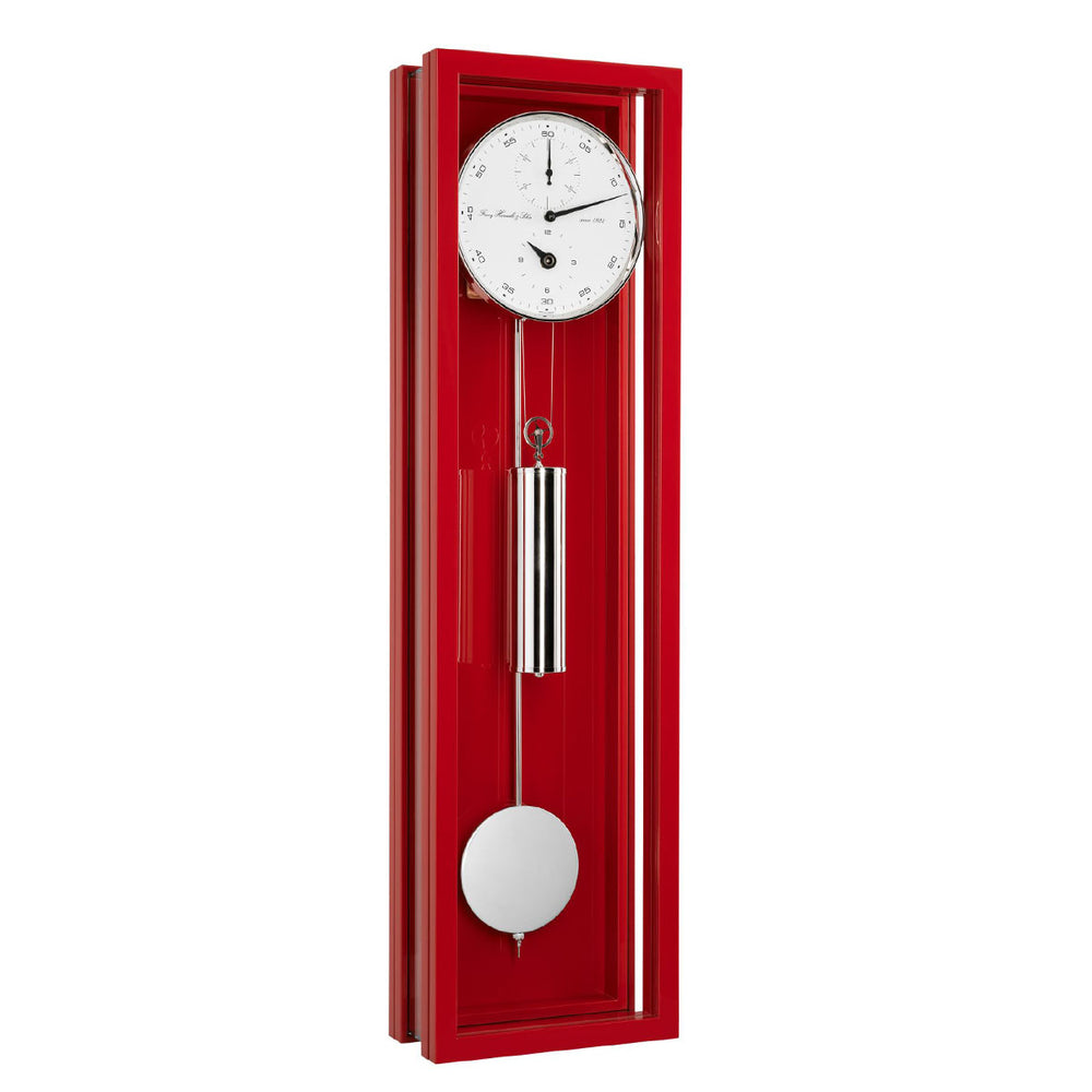 Red wall clock with a white face and pendulum on a white background