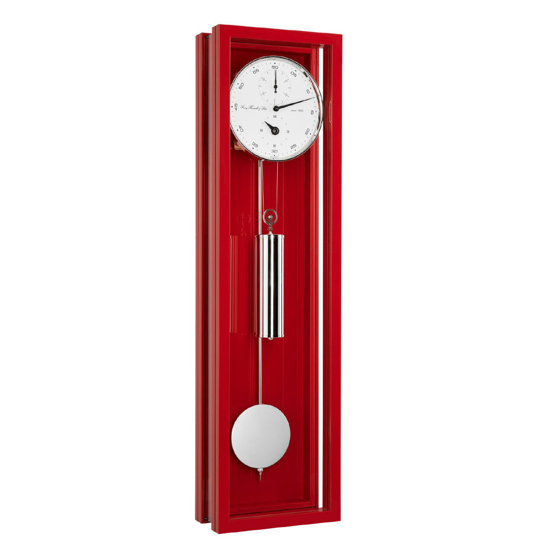 Red wall clock with a white face and pendulum on a white background