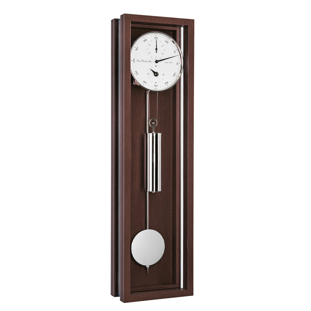 Walnut wood wall clock with pendulum on a white background