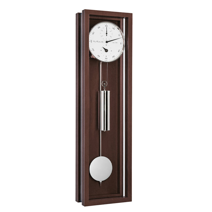 Walnut wood wall clock with pendulum on a white background