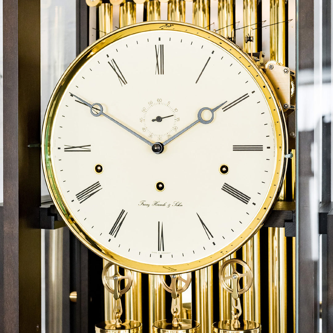 Close up of clock face with brass highlights and seconds display