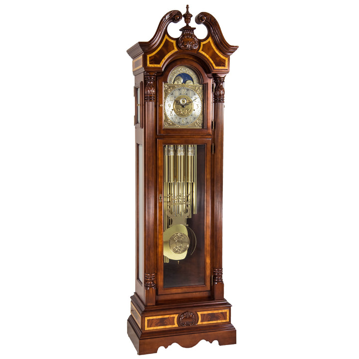 Wooden grandfather clock with intricate design, tubular chime movement and brass pendulum on a white background