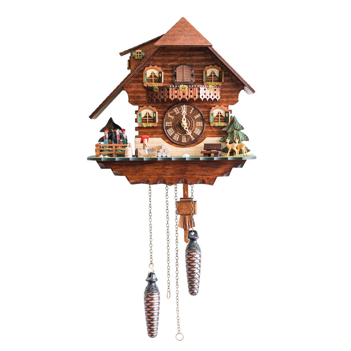 Wooden chalet style cuckoo clock with pine trees on white background.