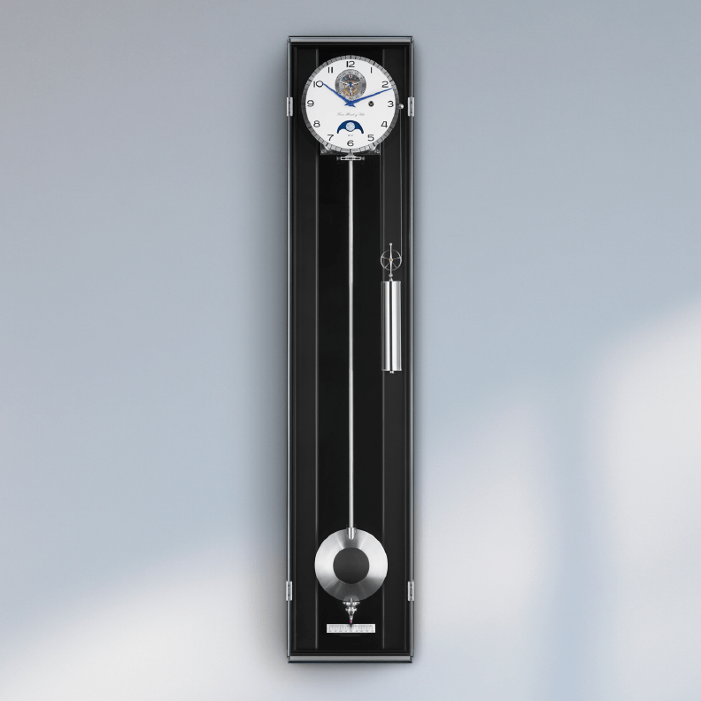 Limited edition luxury wall clock by Hermle on grey wall.