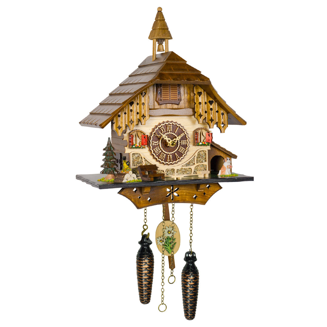 Wooden cuckoo clock with bell tower, red shutters and roman numeral dial on white background.