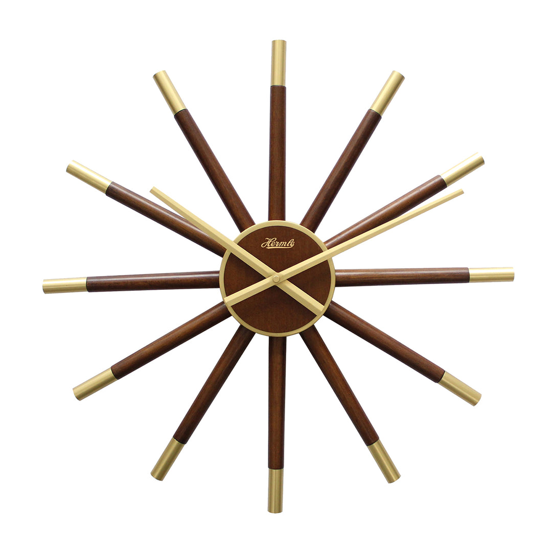 Sunburst style wooden clock with brass highlights and Hermle marking on white background.