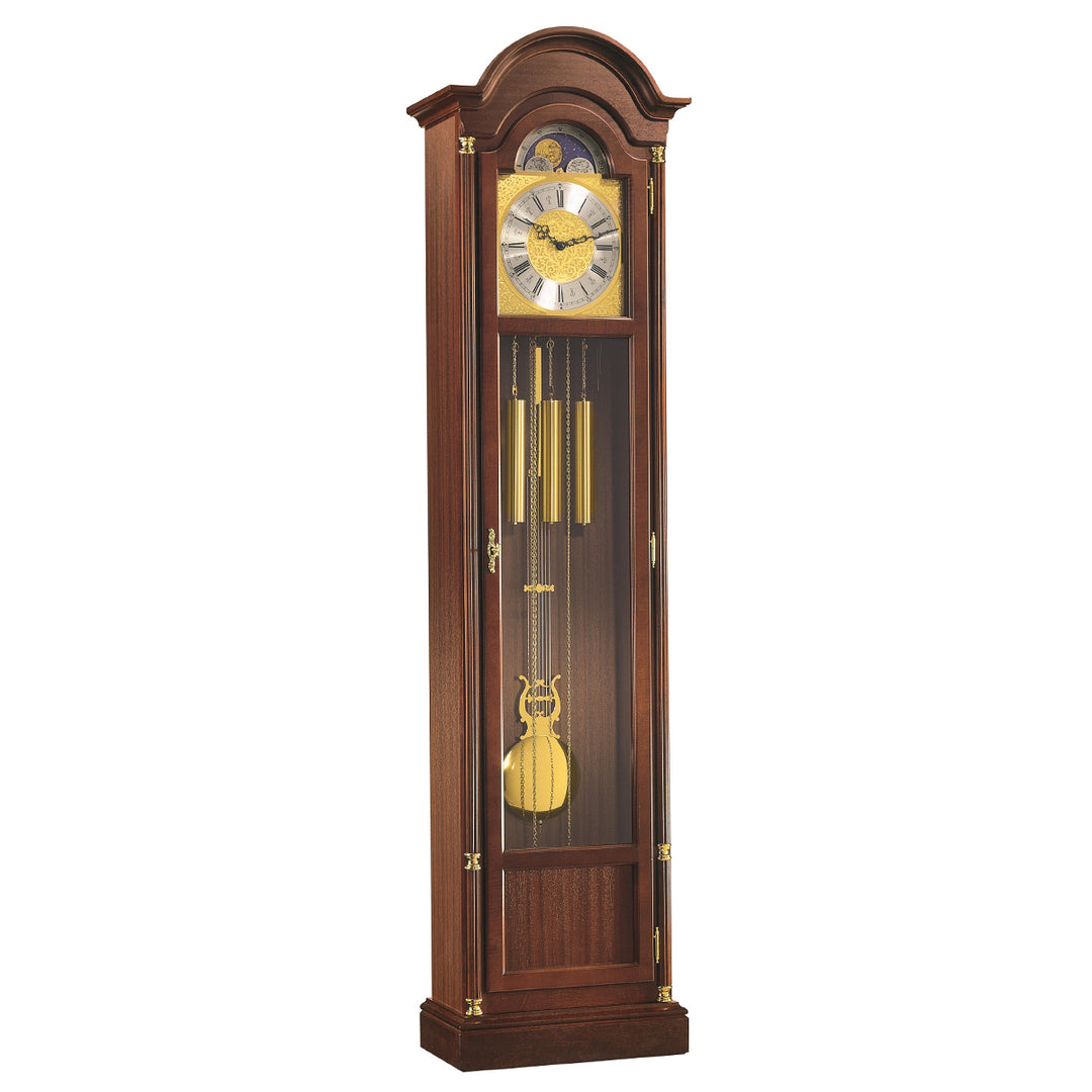 Wooden Longwood grandfather clock by Hermle with pendulum and glass front on a white background.