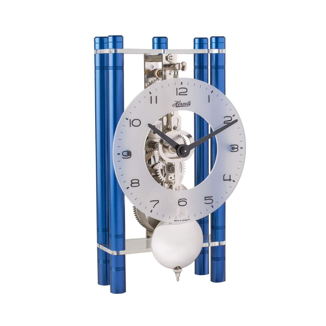 Blue and silver mechanical desk clock with glass face and visible intricate gears