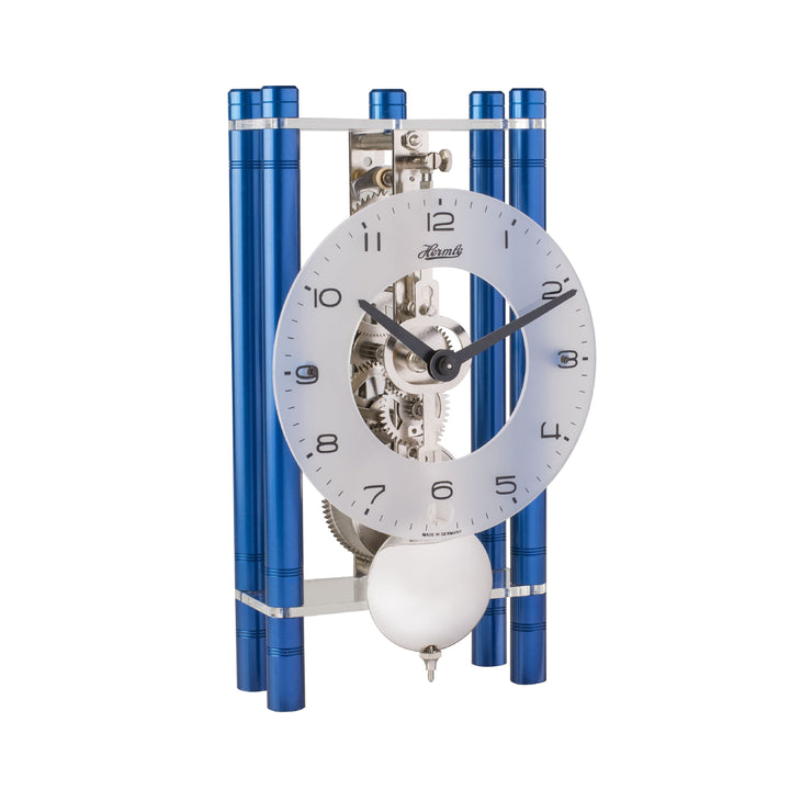 Blue and silver mechanical desk clock with glass face and visible intricate gears