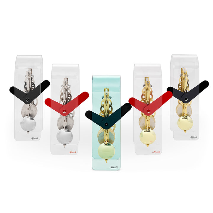 Set of five desk clocks with black and red hands, featuring silver and brass gears visible through clear case