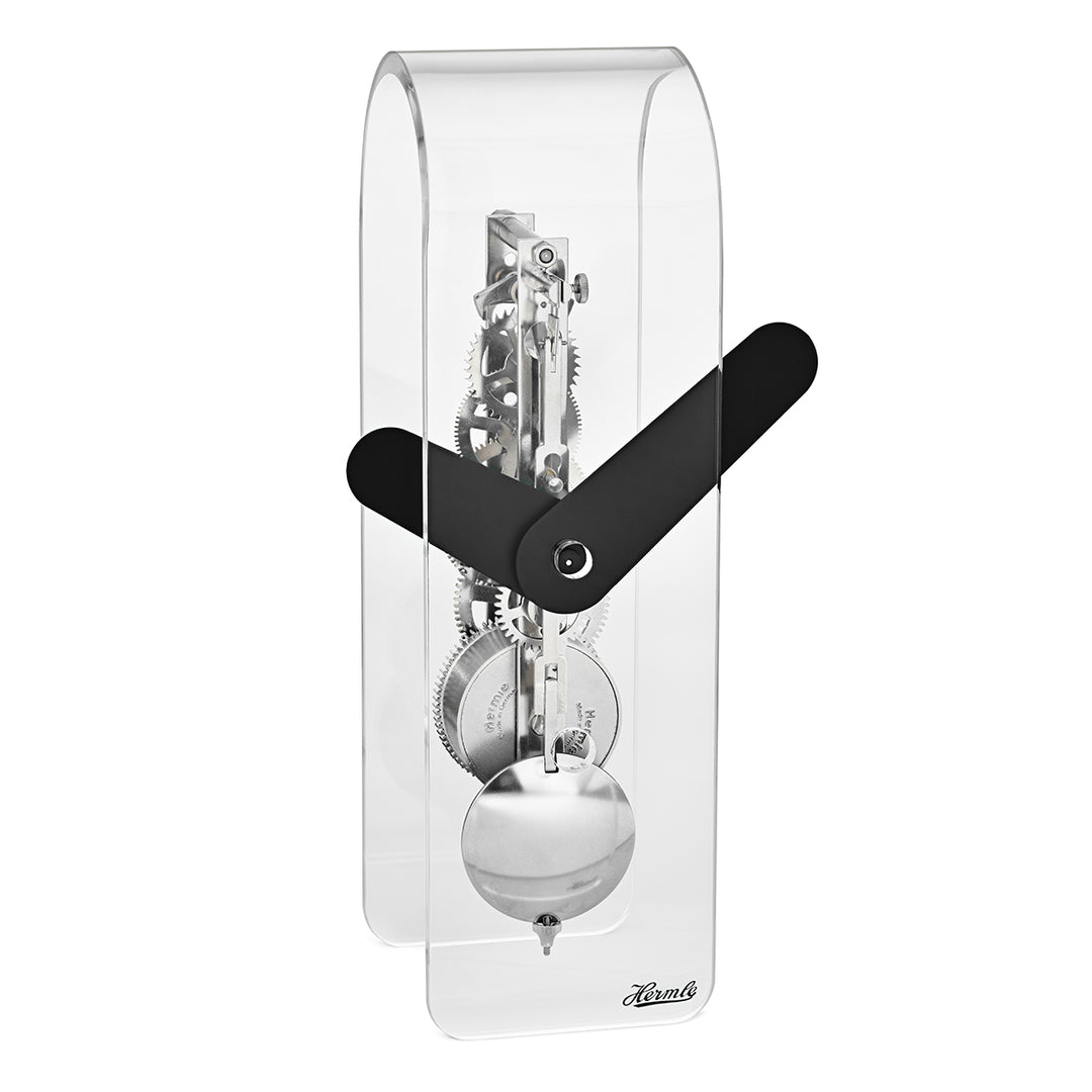 Clear desk clock with visible silver gearing inside and black hands