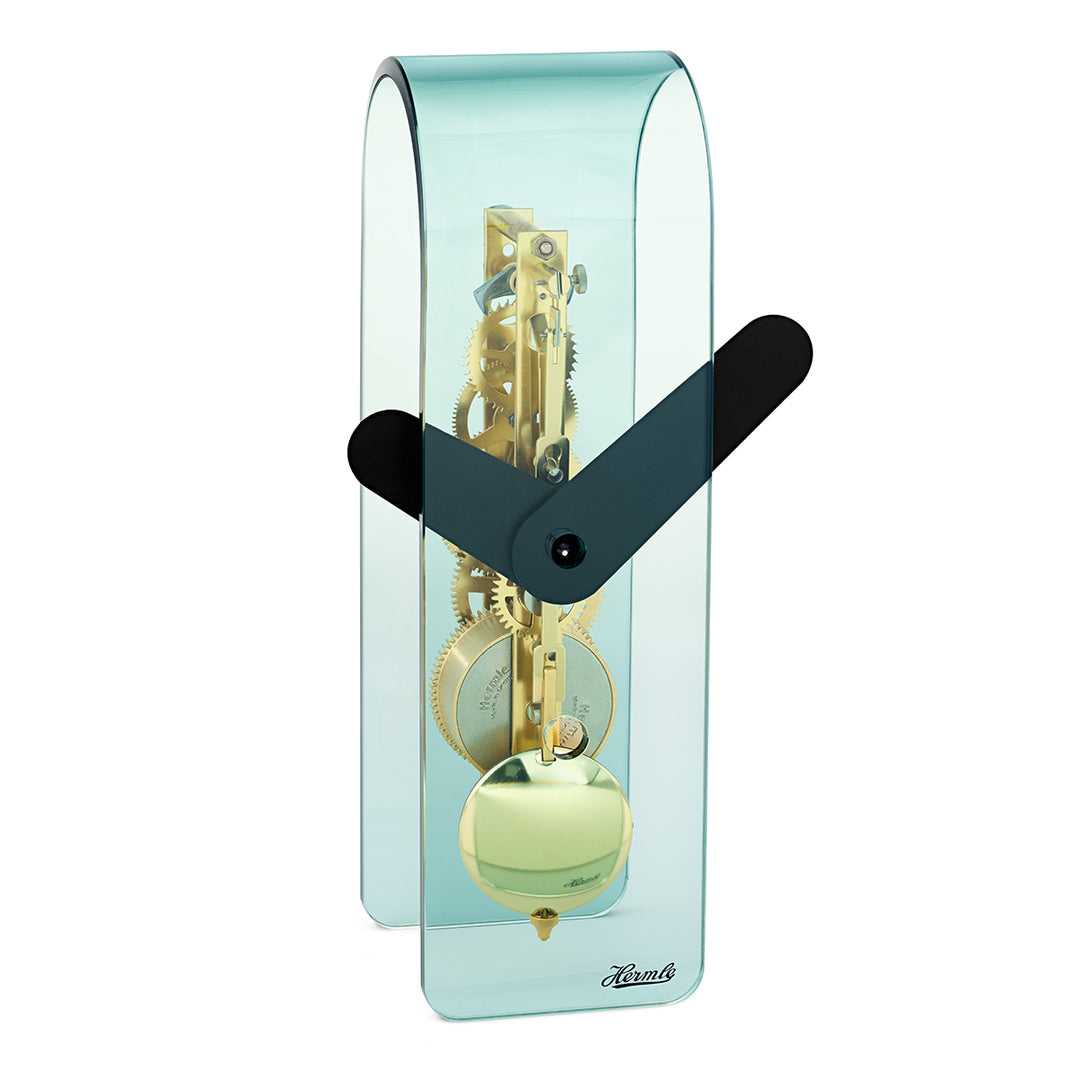 Transparent blue desk clock with visible brass gearing inside and black hands