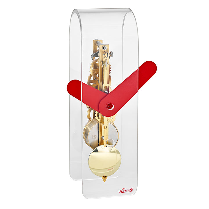Clear desk clock with visible brass gearing inside and red hands
