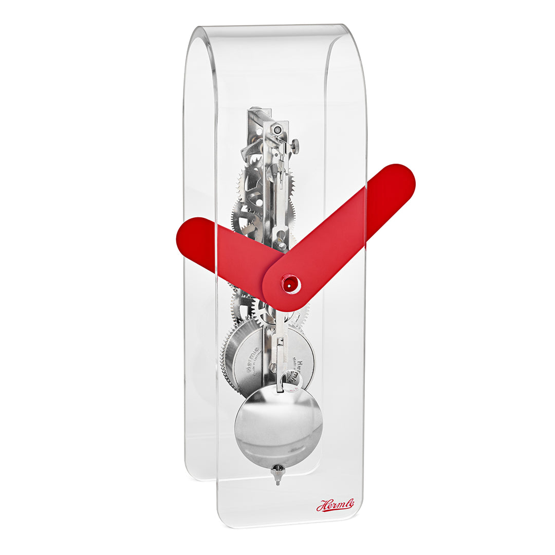 Clear desk clock with visible silver gearing inside and red hands