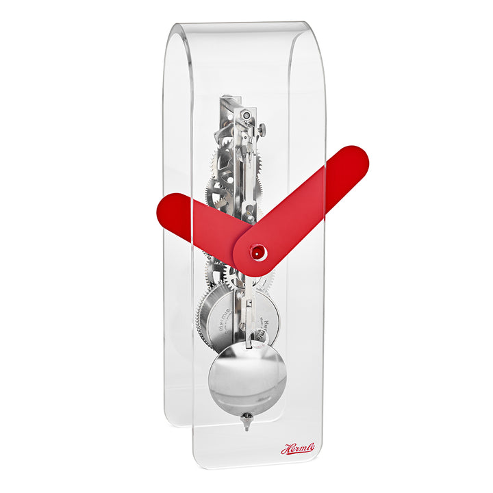 Clear desk clock with visible silver gearing inside and red hands